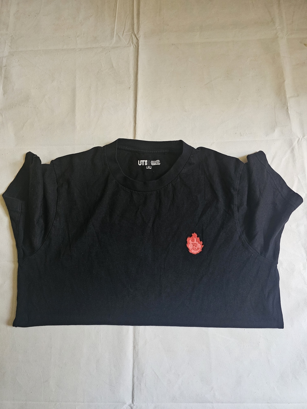 Uniqlo Black Short Sleeve Tee with Small Red Flame Patch